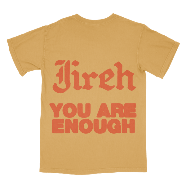 Flatlay - Mustard shirt Jireh You Are Enough on the back in orange text.